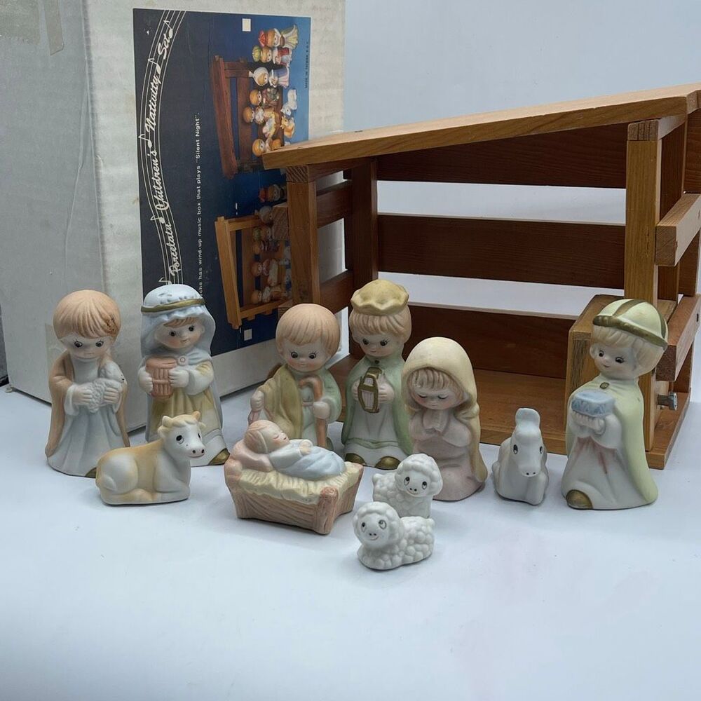 Vintage NIB musical Nativity scene 11 porcelain and 1 heavy duty wood crèche.